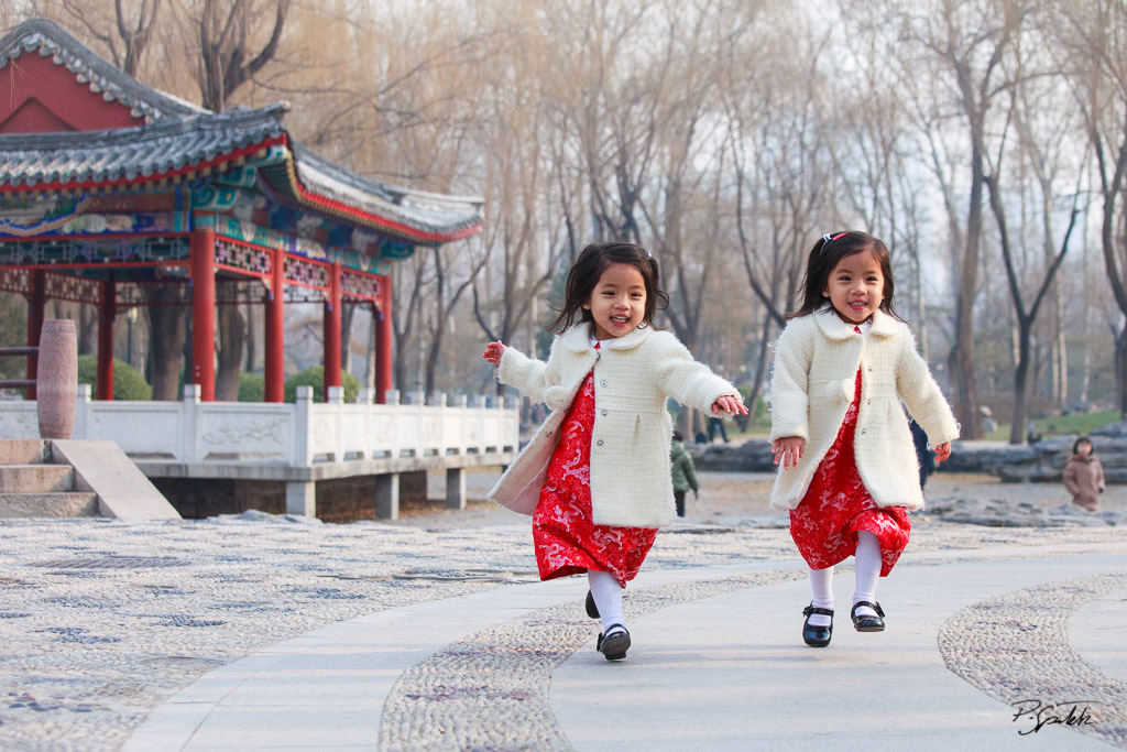 Chinese twins playing in Ritan Park, Chaoyang District, Beijing. 21.12.11