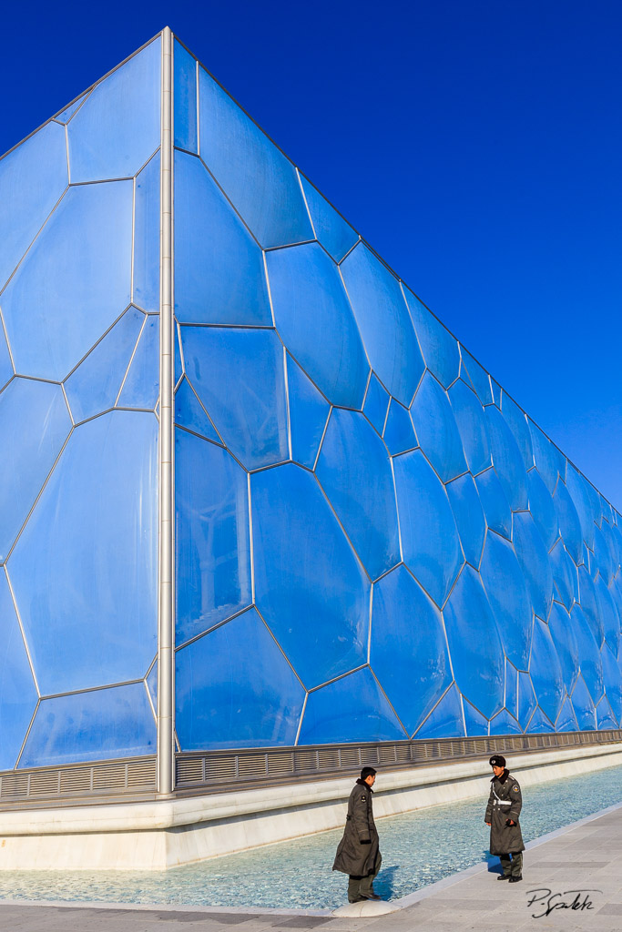 Policemen monitoring the Water Cube in the Beijing Olympic Center. 06.03.09