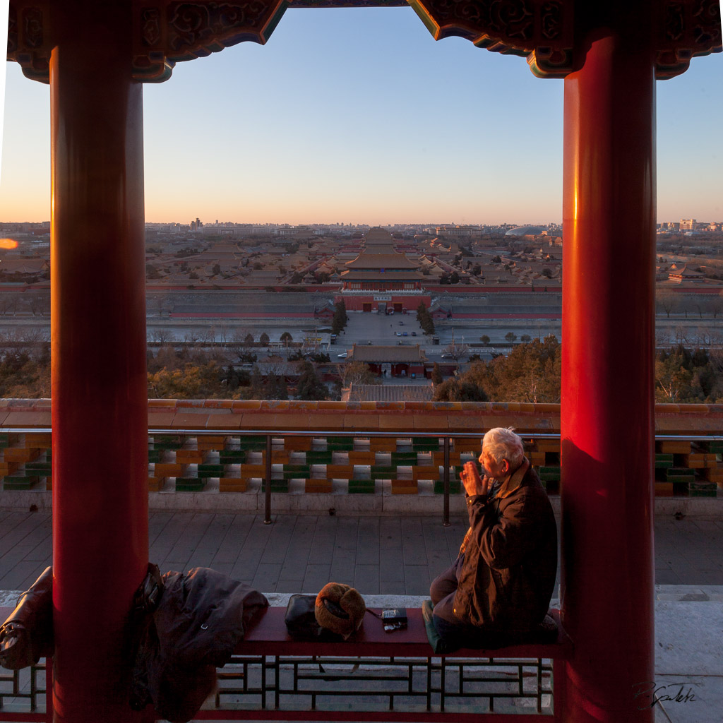Old man doing exercise at sunrise on the top of Jingshan Park. Just below is the north entrance of the Forbidden City. Beijing. 16.02.12