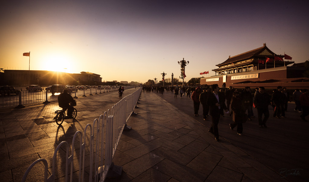A man passing through Tiananmen square during sunset. Beijing 22.11.11