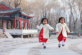 Chinese twins playing in Ritan Park, Chaoyang District, Beijing. 21.12.11