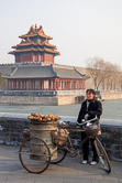 Sweet potato seller in the north west corner out of the Forbidden City. Beijing 28.02.09