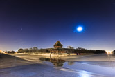 Moon shining over the north west corner of the Forbidden City in Beijing. 16.02.12 Time: 05:49