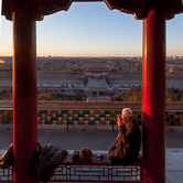 Old man doing exercise at sunrise on the top of Jingshan Park. Just below is the north entrance of the Forbidden City. Beijing. 16.02.12