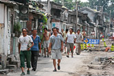 Workes coming back home in a Beijing hutong alley.