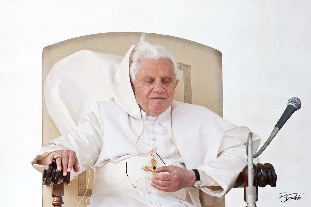 A gust  of wind blows up pope's cape during his weekly audience in St. Peter's Square. Vatican City, October 22, 2010.