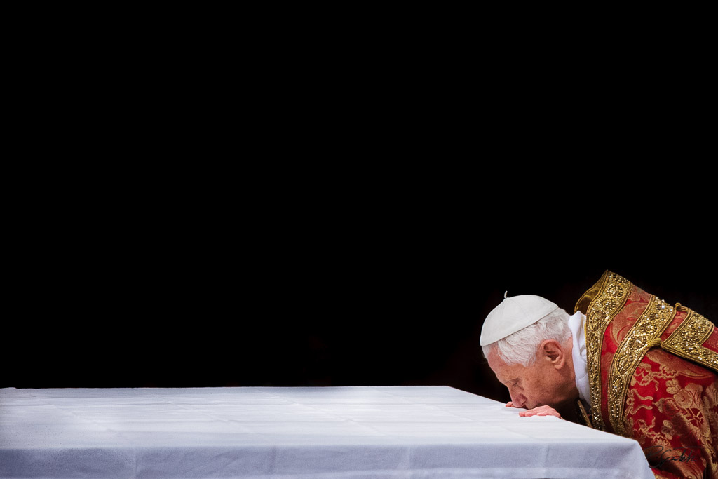 Pope Benedict XVI kisses the altar during the first Vesper at St. Paul Outside the Walls Basilica. Rome, June 28, 2010.