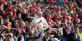 Faithful waves to the Pope Benedict XVI as he arrives to lead his weekly audience in St. Peter's square. Vatican City, october 22, 2010.