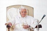 A gust  of wind blows up pope's cape during his weekly audience in St. Peter's Square. Vatican City, October 22, 2010.