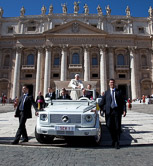 Pope Benedict XVI waves to the faithful gathered in St. Peter's square at the end of his weekly audience as he goes back on his popemobile . Vatican City, October 6, 2010