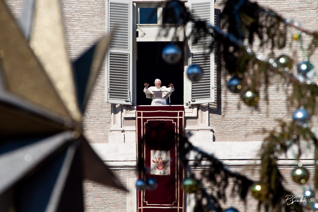 Pope Benedict XVI greets the faithful from his window in vatican palace during the angelus prayer in st. Peter square. Vatican city, January 16 2011.