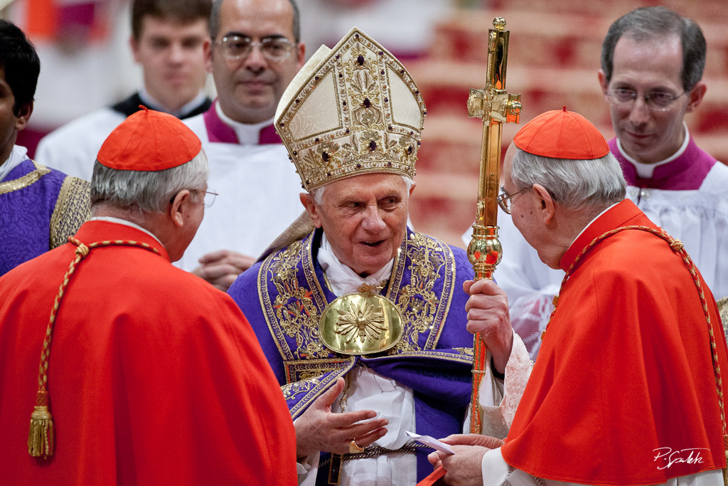Pope Benedict XVI speaks with two cardinals after celebrateing the Vespers prayer on the first Sunday of Advent in the St. Peter's Basilica. Vatican City, November 27, 2010.